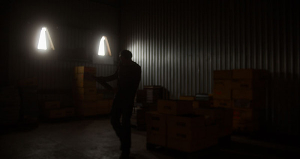 Julian inside a darkened shed. 