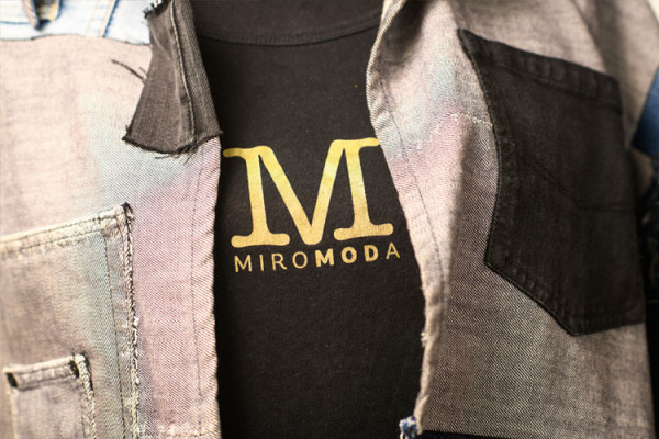 Close up of Miromodo jacket and shirt with logo