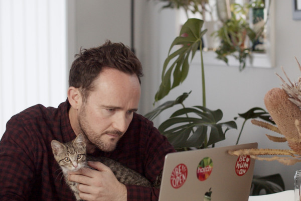 pat shepherd and crumpet Pat and his pet cat looking at a laptop